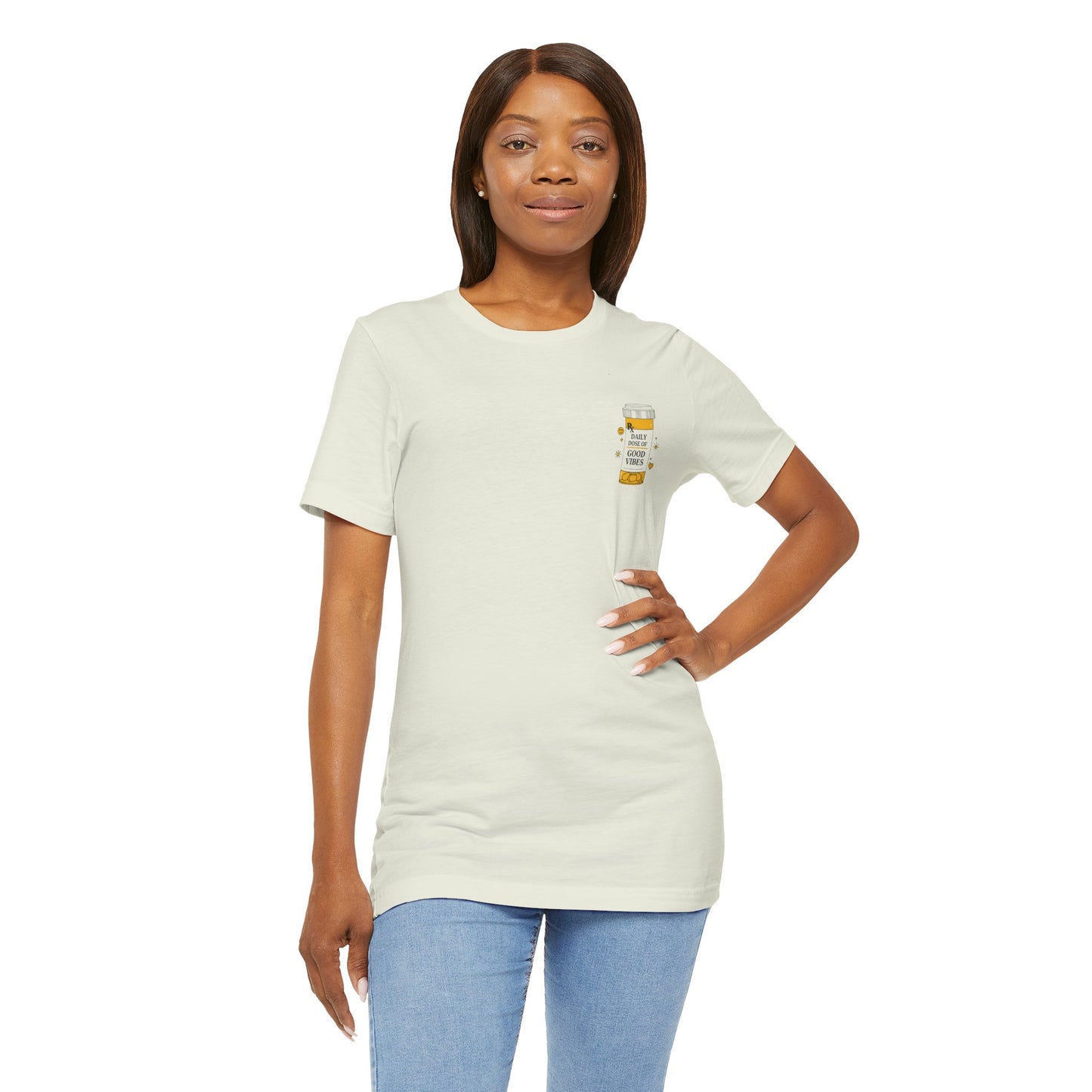 Woman wearing a beige t-shirt with a prescription bottle good vibes graphic on a white background