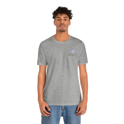 Person wearing a gray t-shirt with a  lilac heart logo on a white background