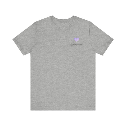 Gray t-shirt with a small  lilac heart logo on the chest against a white background