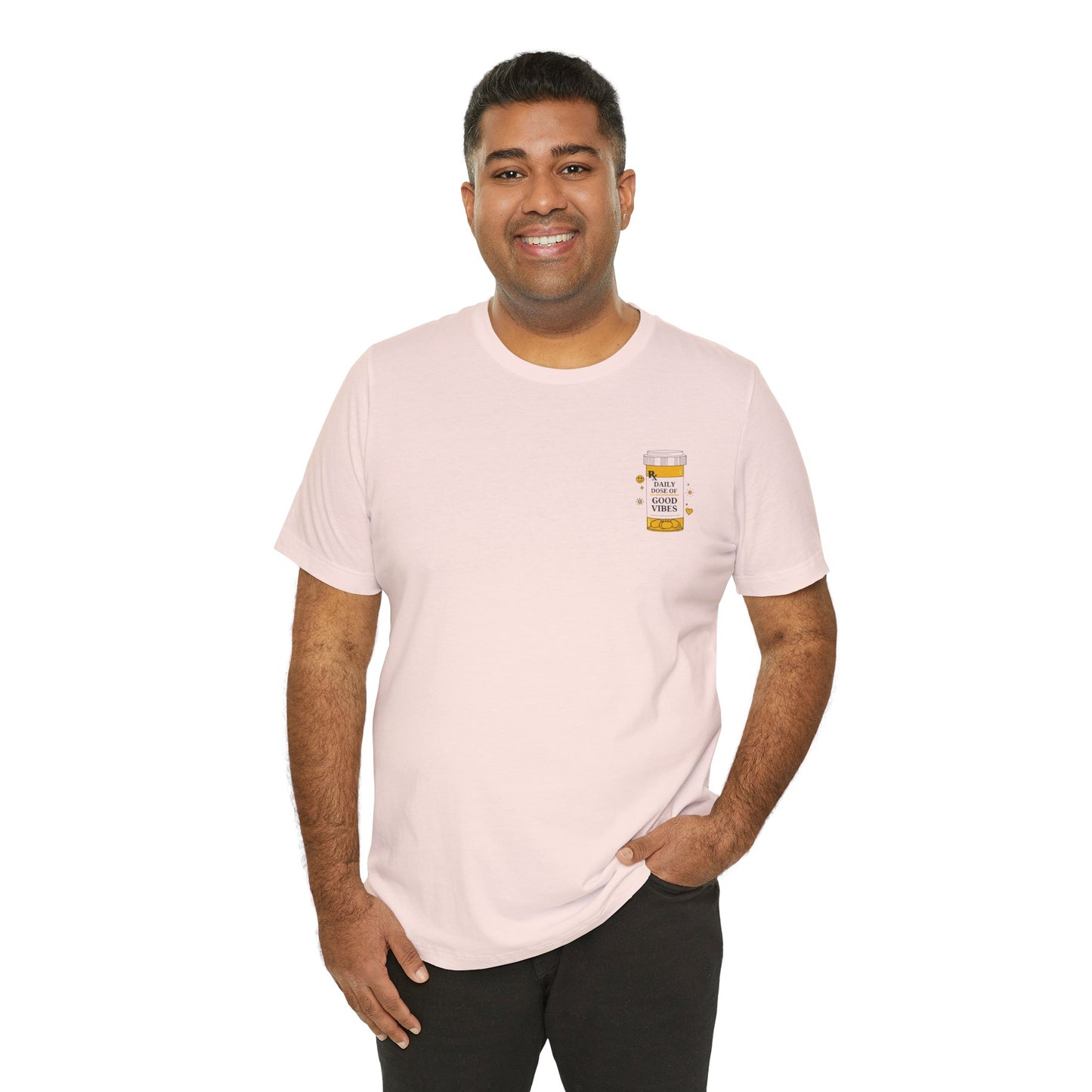 Man wearing a light pink t-shirt with a prescription bottle good vibes graphic on a white background
