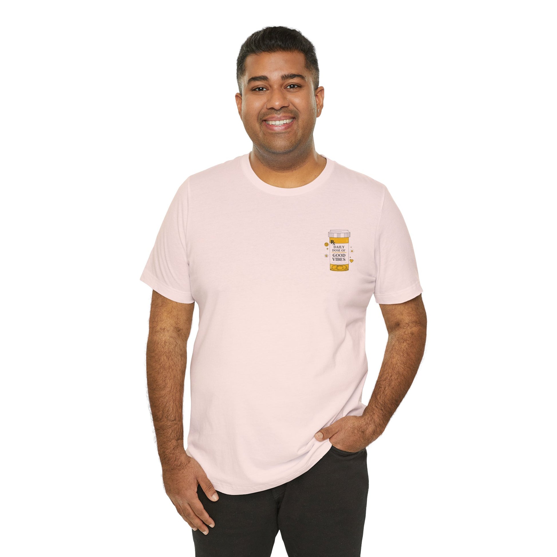 Man wearing a light pink t-shirt with a prescription bottle good vibes graphic on a white background