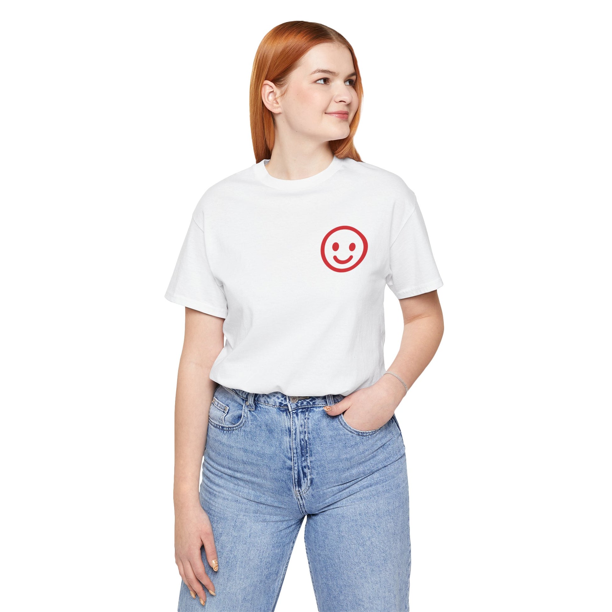 Person wearing a white t-shirt with a red smiley face design on a white background