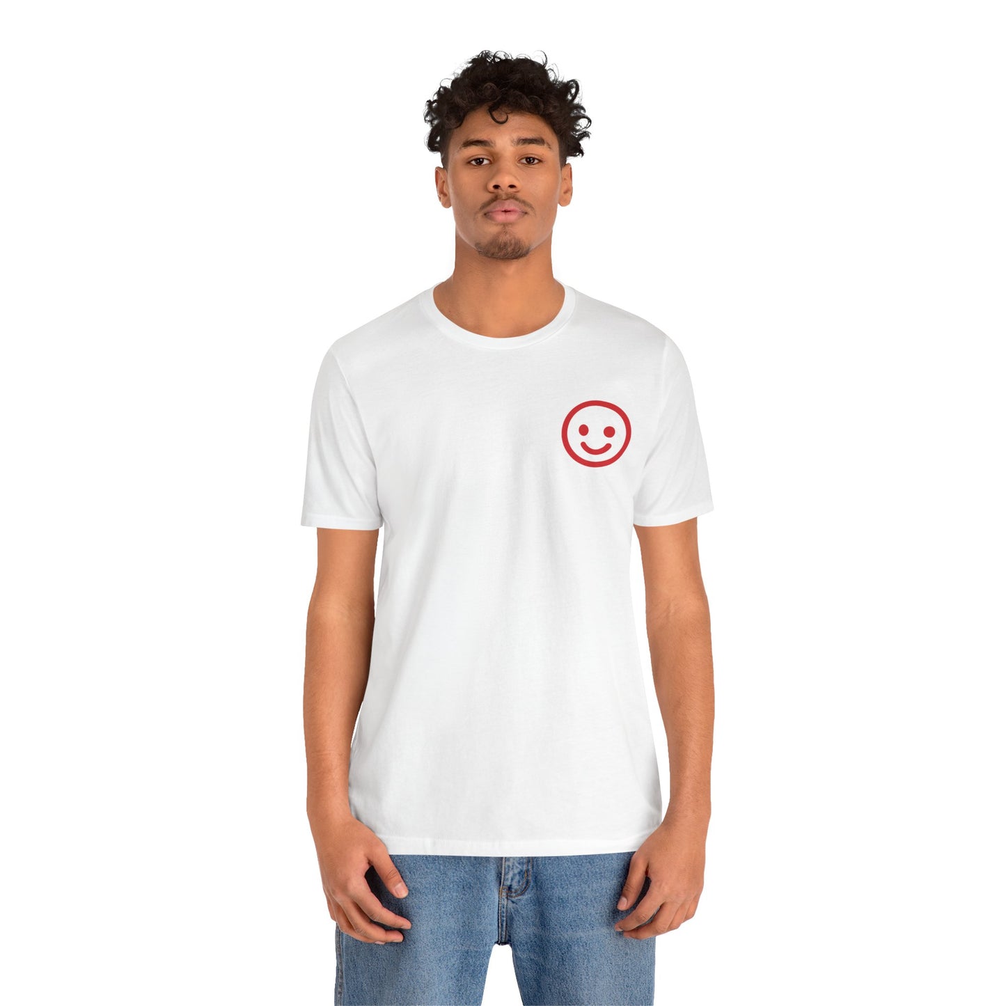 Person wearing a white t-shirt with a red smiley face design on a white background