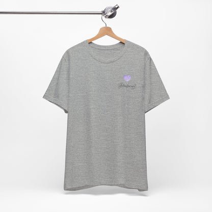 Gray t-shirt with a  lilac heart logo on a hanger against a white background