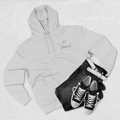 Gray hoodie with a blue/green/yellow heart logo logo, black jeans, and black sneakers on a light gray background