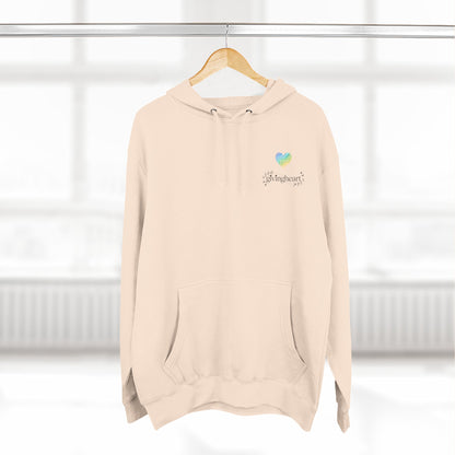 Beige hoodie with a blue/green/yellow heart logo on a hanger against a white background