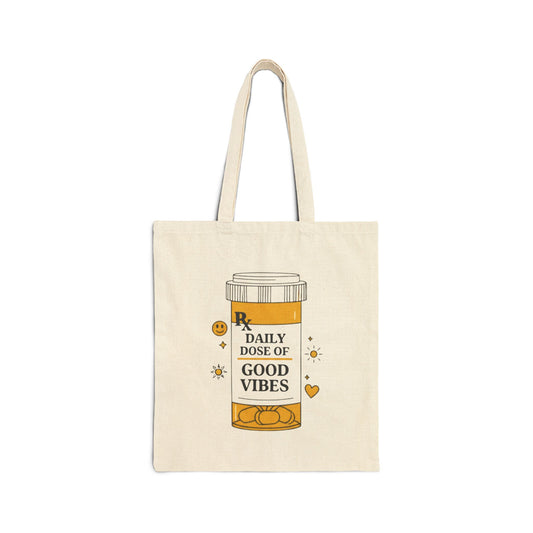 Tote bag with a design of a pill bottle labeled 'Daily Dose of Good Vibes' on a white background