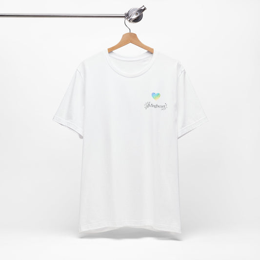 White t-shirt with a blue, yellow, and green heart logo on a hanger against a white background