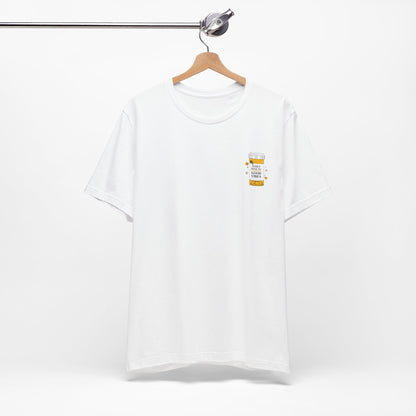White t-shirt with a small prescription bottle good vibes graphic on a hanger against a white background
