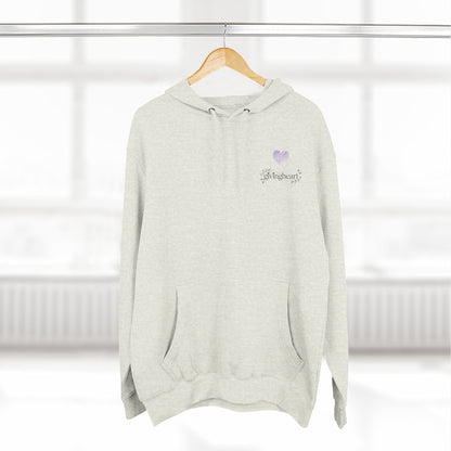 Light gray hoodie with a lilac colored heart logo on a wooden hanger against a white background