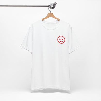 White t-shirt with a red smiley face design on a hanger against a white background