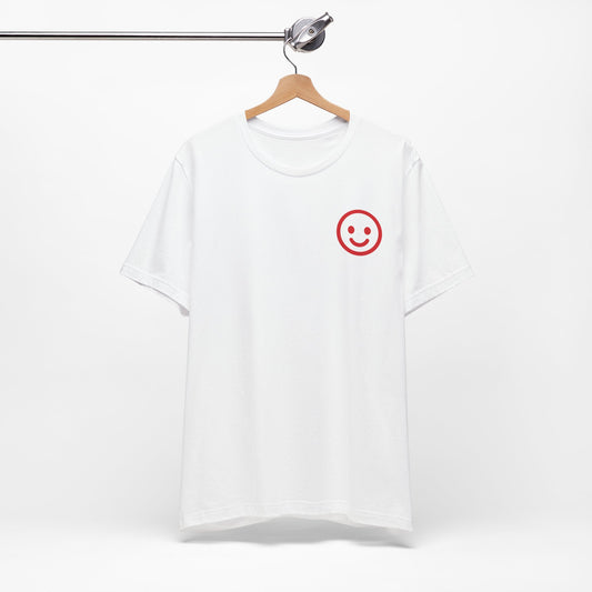 White t-shirt with a red smiley face design on a hanger against a white background